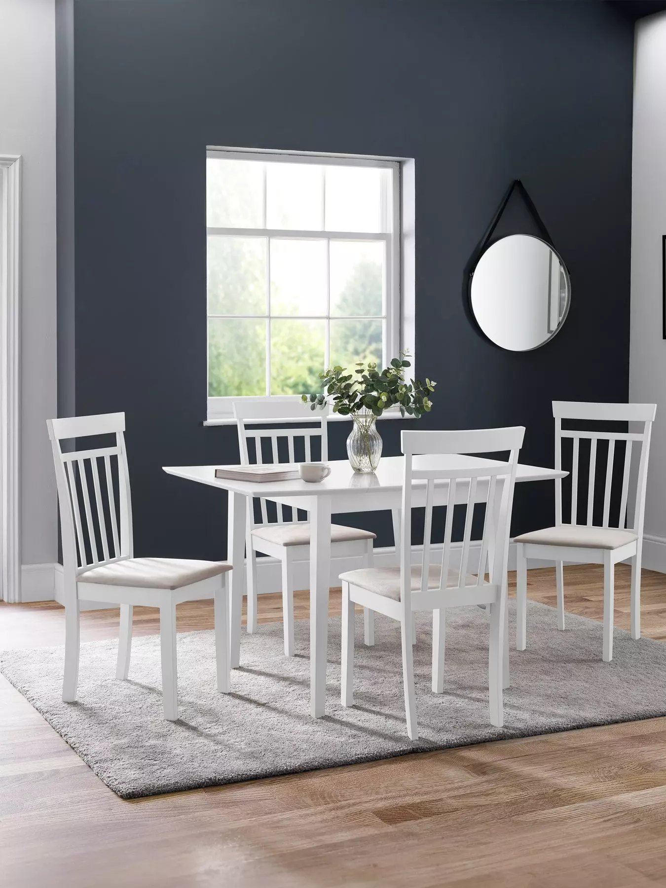 https://media.very.co.uk/i/very/UPTY2_SQ1_0000000013_WHITE_RSr/julian-bowen-rufford-80-160-cm-extending-diningnbsptable-4-coast-chairs-white.jpg?$180x240_retinamobilex2$&$roundel_very$&p1_img=delivery_christmas&fmt=webp