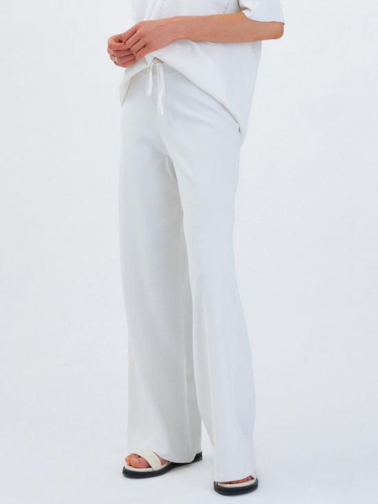 front image of aligne-fletcher-wide-long-knitted-trouser-in-eco-viscose