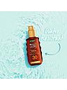 Image thumbnail 4 of 5 of Garnier Ambre Solaire Ideal Bronze Protective Oil Sun Cream Spray SPF30, UVA &amp; UVB Protection, 150ml (SAVE 32%)
