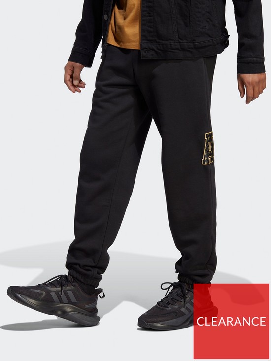 front image of adidas-sportswear-all-szn-x-logomania-joggers-black