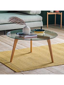Product photograph of Gallery Simard Round Glass Top Coffee Table - Oak from very.co.uk