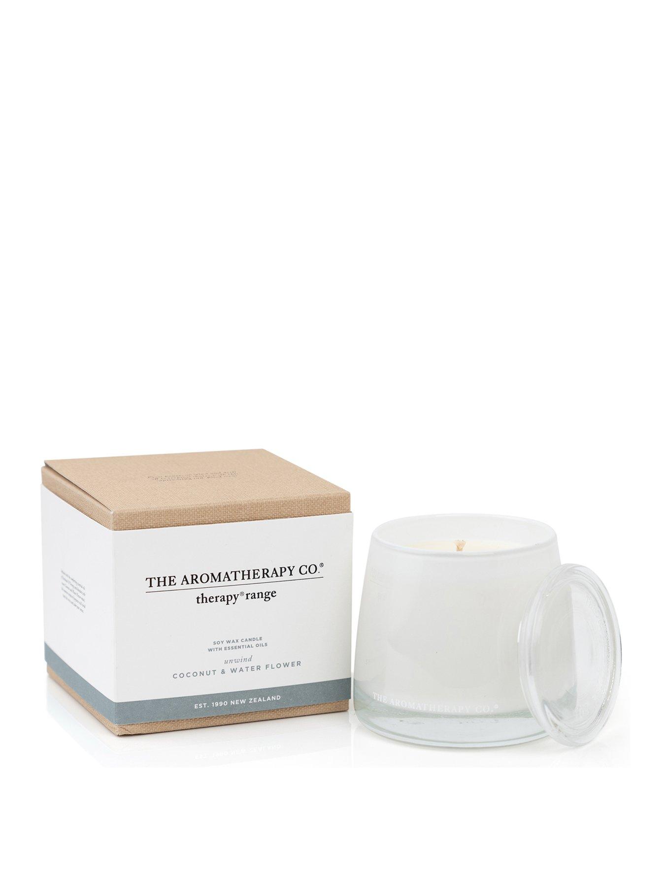 Product photograph of The Aromatherapy Co Unwind Therapy Candle - Coconut Water Flower from very.co.uk
