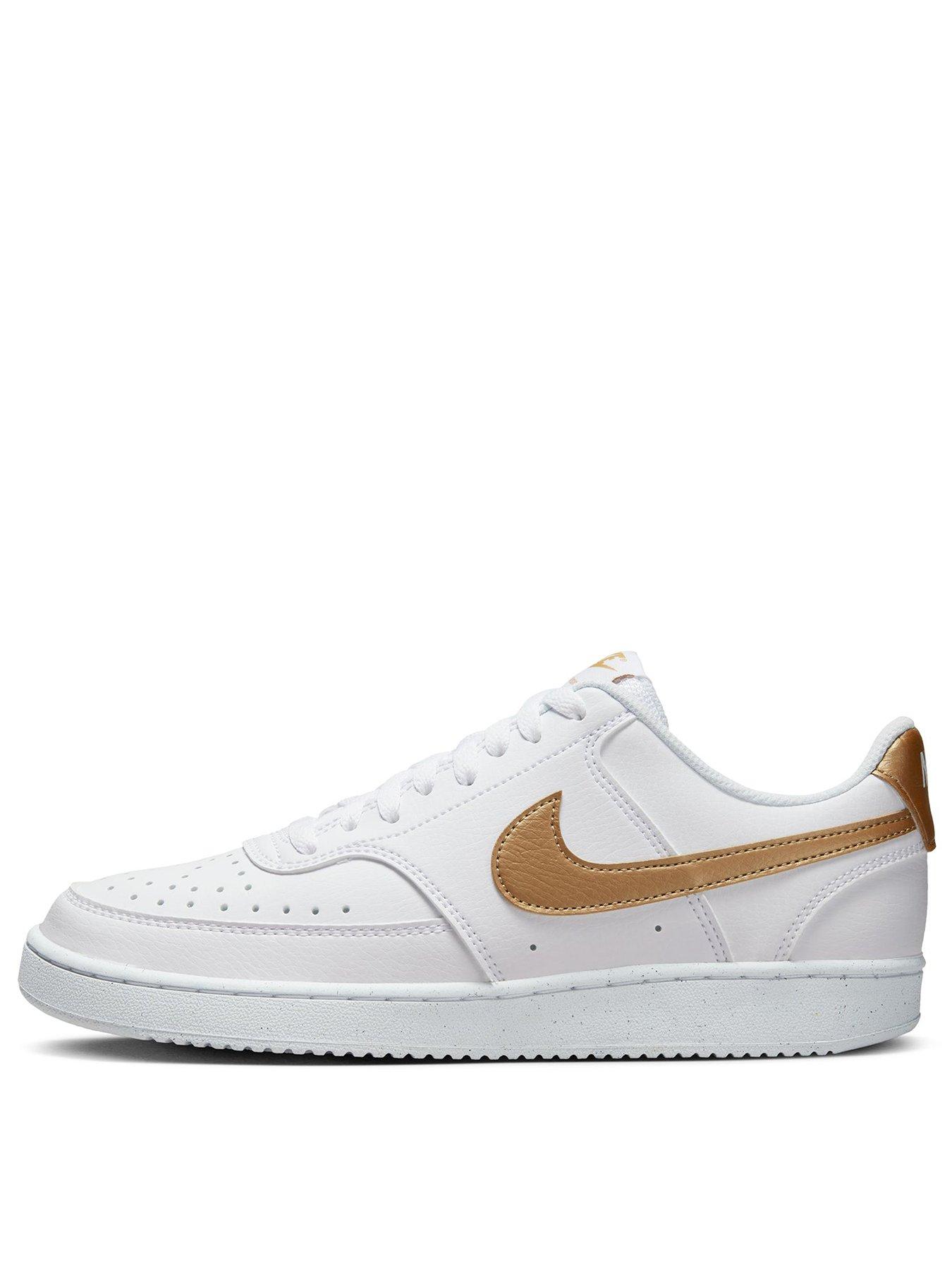 white and gold nike trainers