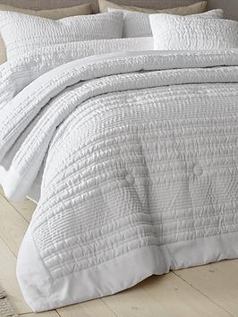 Product photograph of Catherine Lansfield Lennon Stripe Seersucker Bedspread Throw In White from very.co.uk