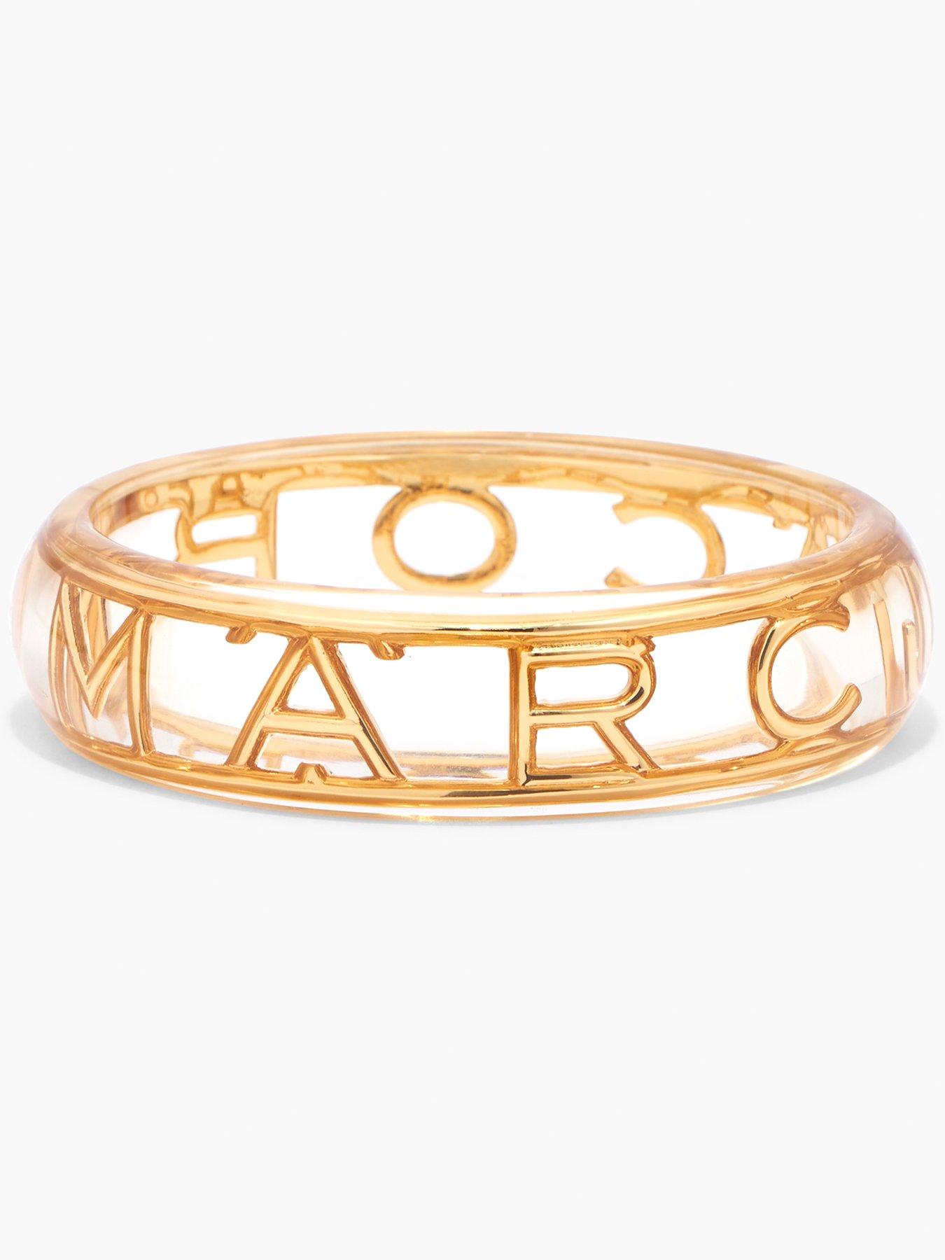 Product photograph of Marc Jacobs The Logo Bangle - Clear Gold from very.co.uk