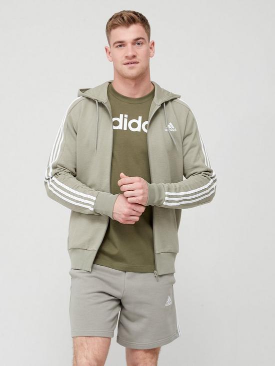 front image of adidas-sportswear-essentials-french-terry-3-stripes-full-zip-hoodie-light-green