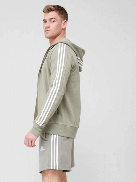 stillFront image of adidas-sportswear-essentials-french-terry-3-stripes-full-zip-hoodie-light-green