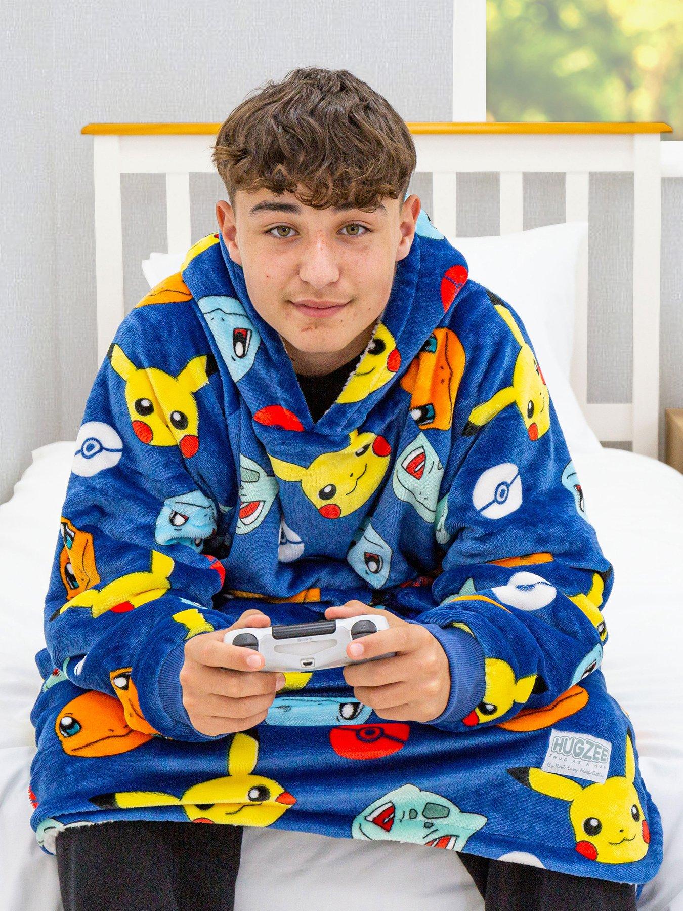 Product photograph of Pokemon Badges Wearable Fleece Large - Blue from very.co.uk