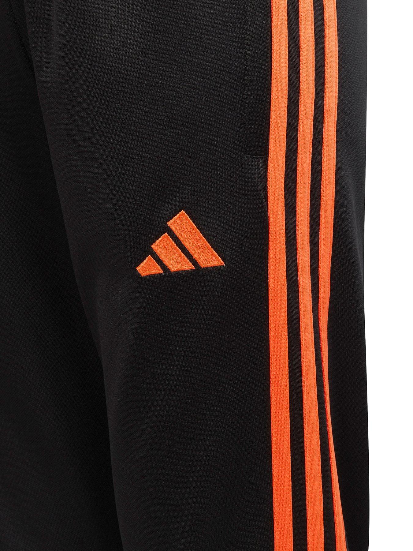 Orange and store black adidas pants