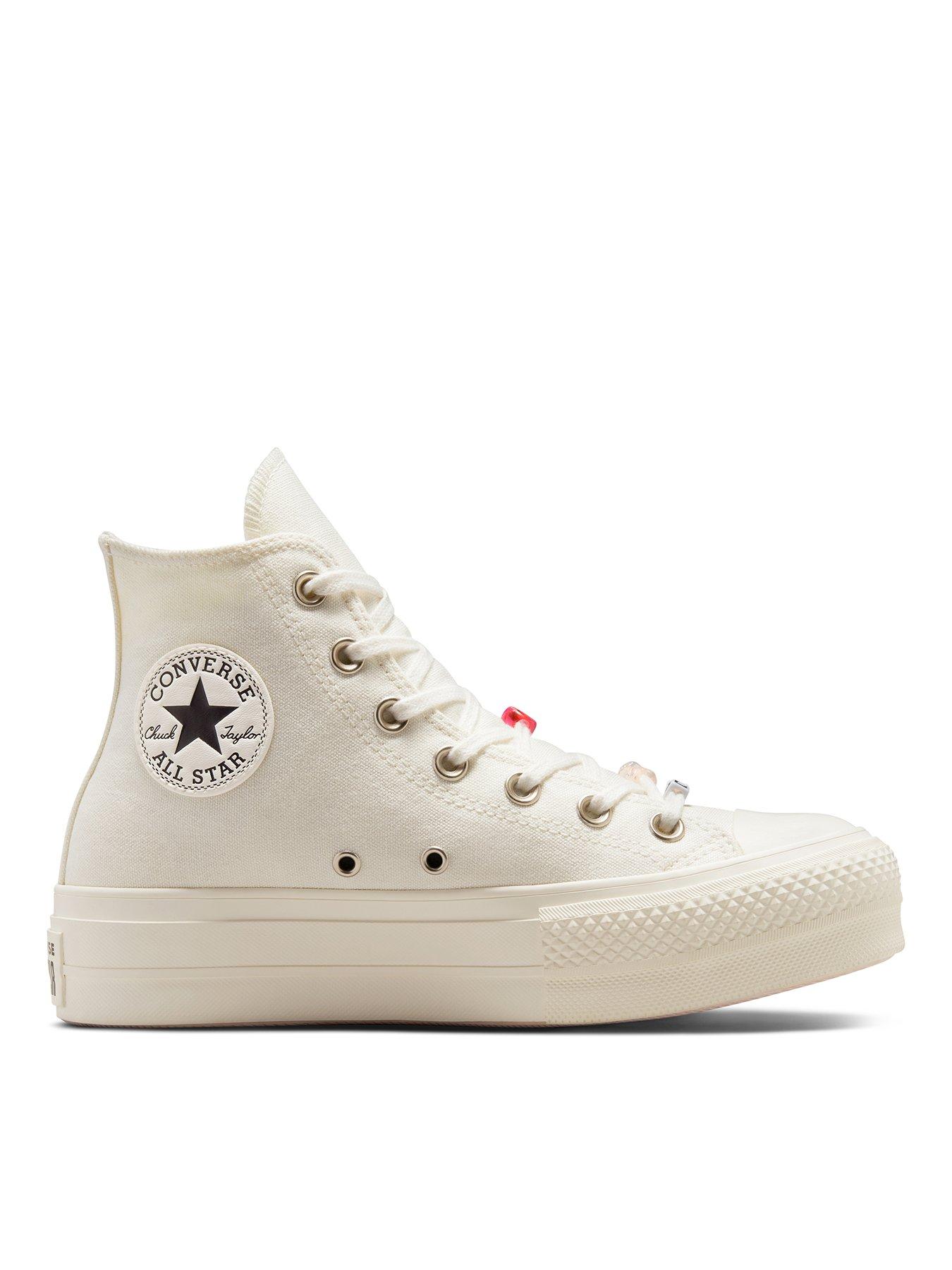 White converse shop with holes