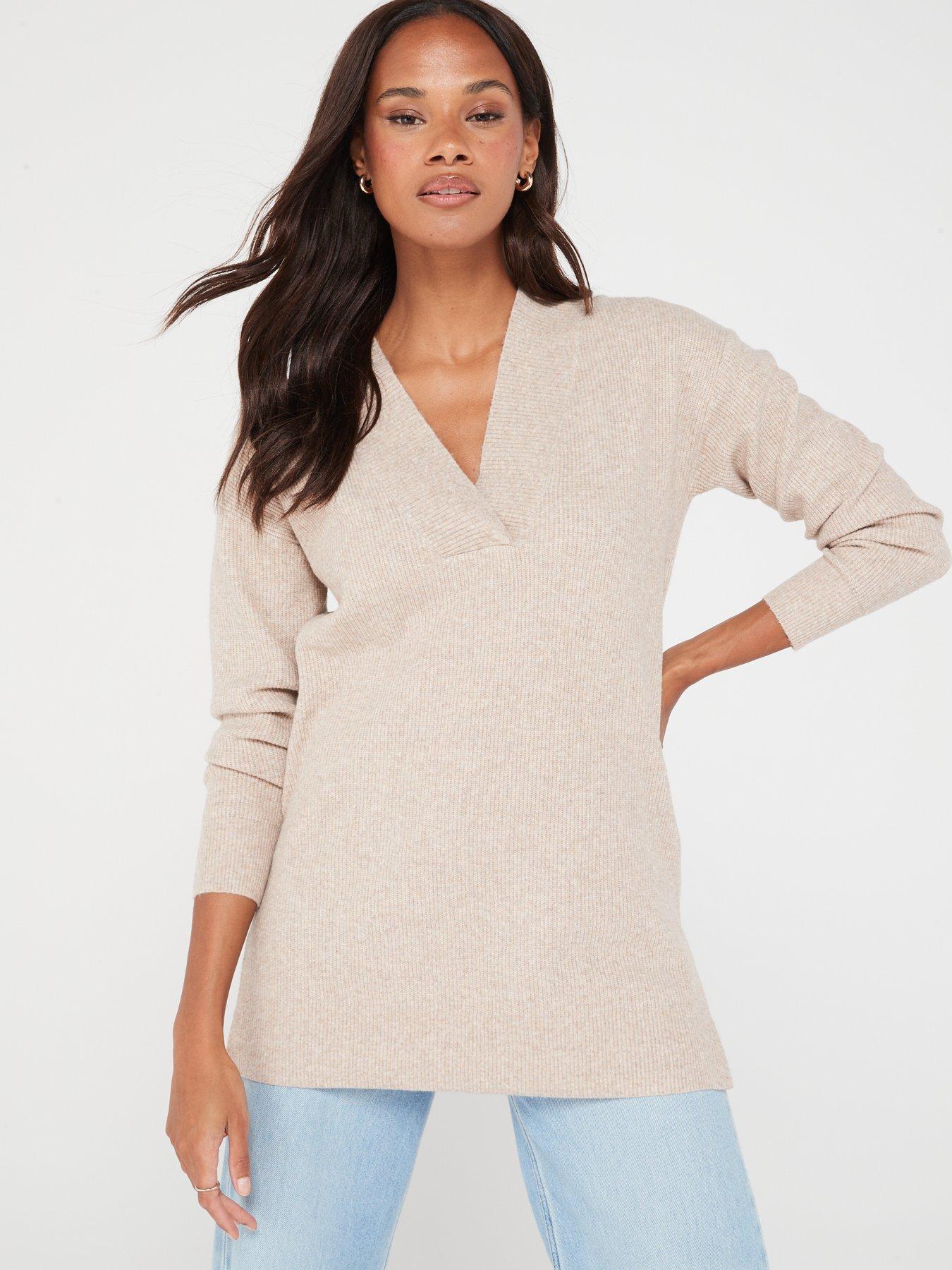 Turtleneck blouse with front slit and cuffed sleeves in beige