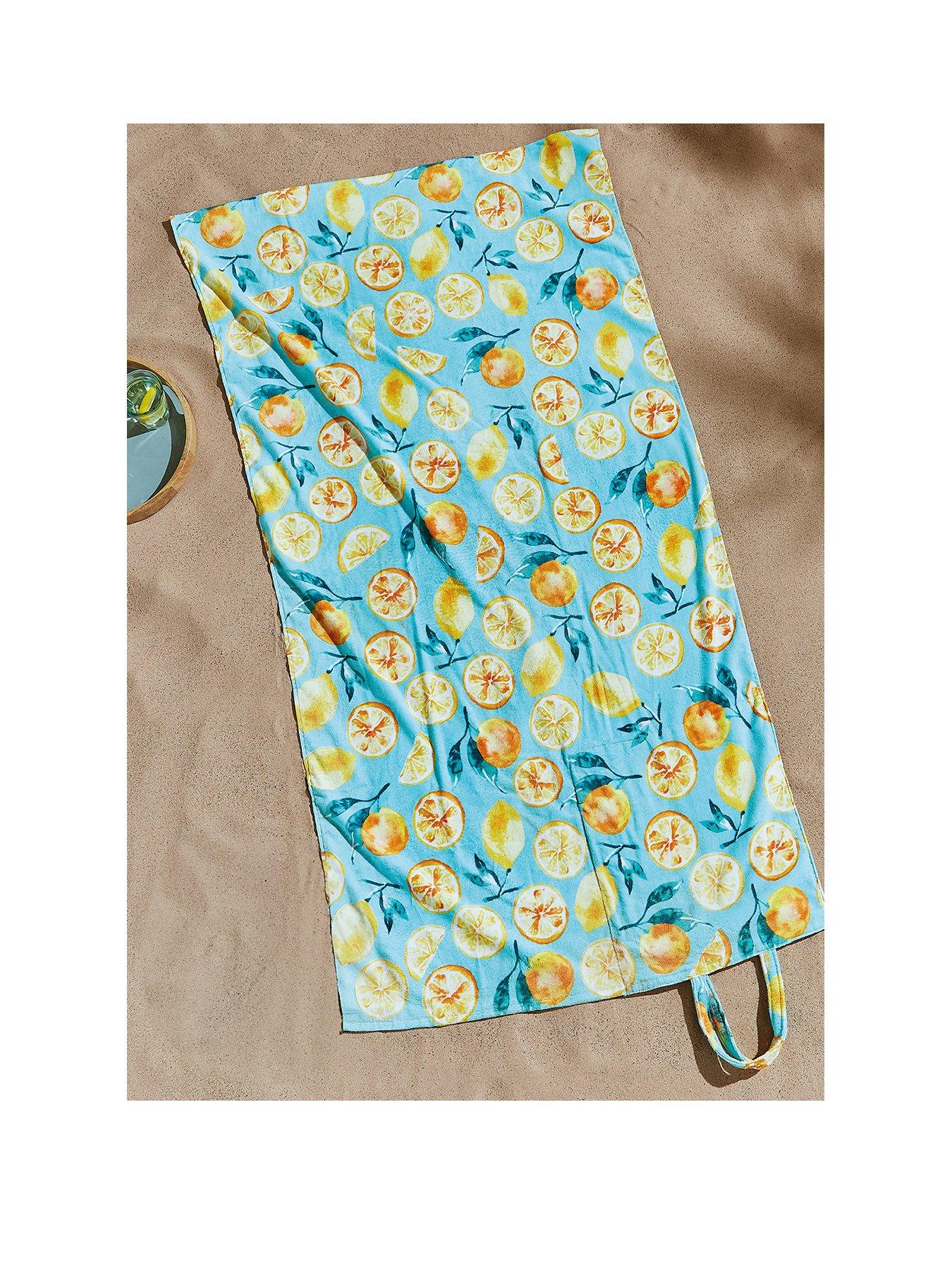 Product photograph of Catherine Lansfield Fruits Beach Towel In A Bag- Green from very.co.uk