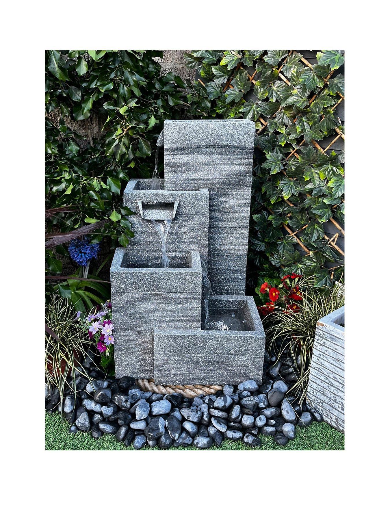Product photograph of Tranquility Grey 4 Pillars Mains Powered Water Feature from very.co.uk