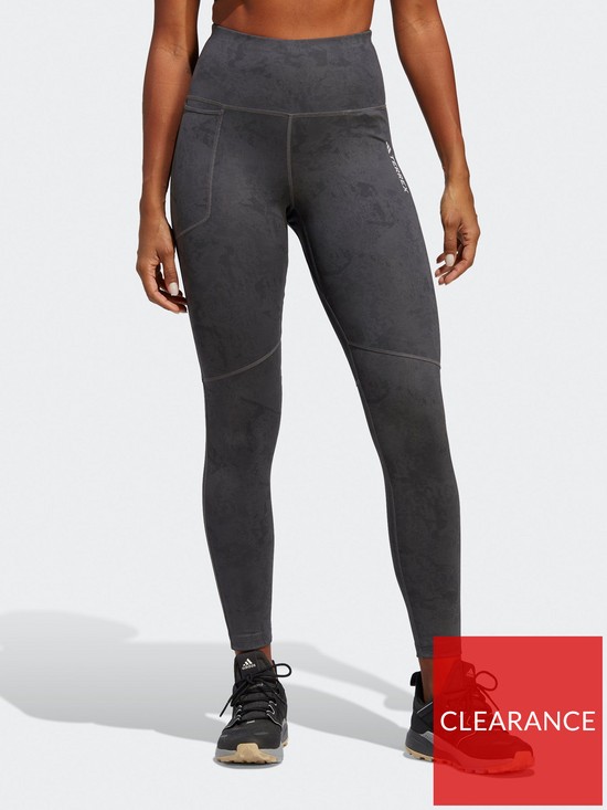 front image of adidas-terrex-womens-multi-allover-print-leggings-grey