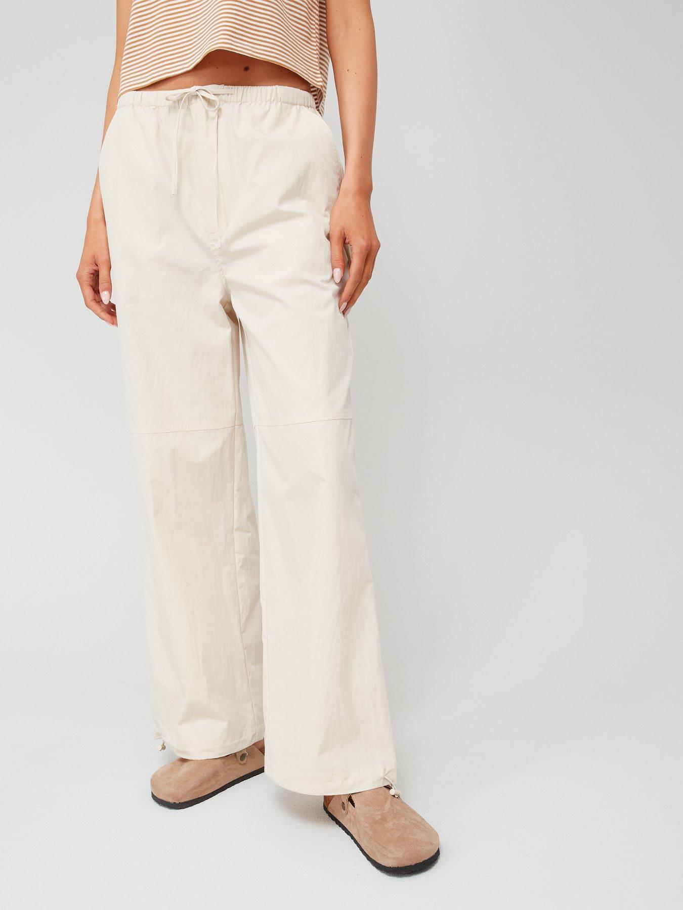 Buy MANGO Women Beige Regular Fit Solid Parallel Trousers - Trousers for  Women 6612380 | Myntra