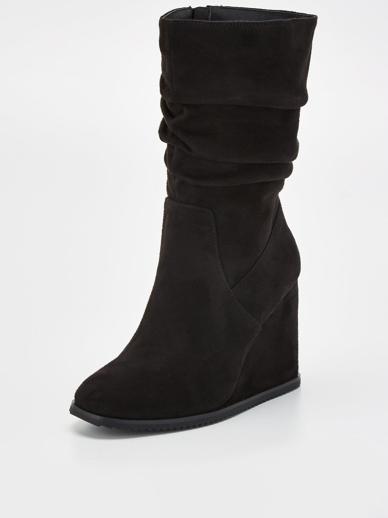 Calf high hot sale wedge boots