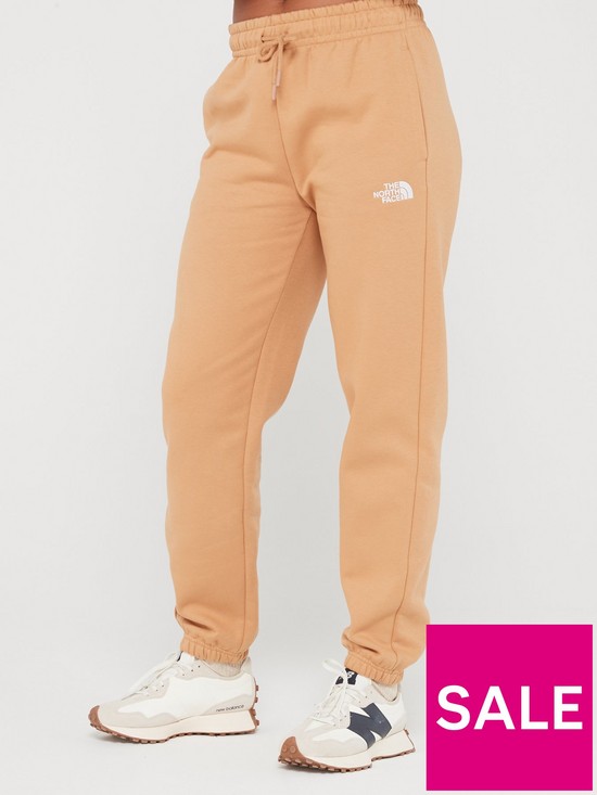 front image of the-north-face-womens-essential-jogger-brown