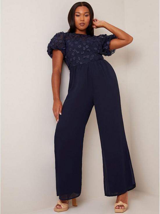 front image of chi-chi-london-flutter-sleeve-lace-wide-leg-jumpsuit-in-navy