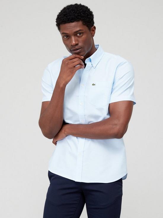 front image of lacoste-short-sleeve-oxford-shirt-blue