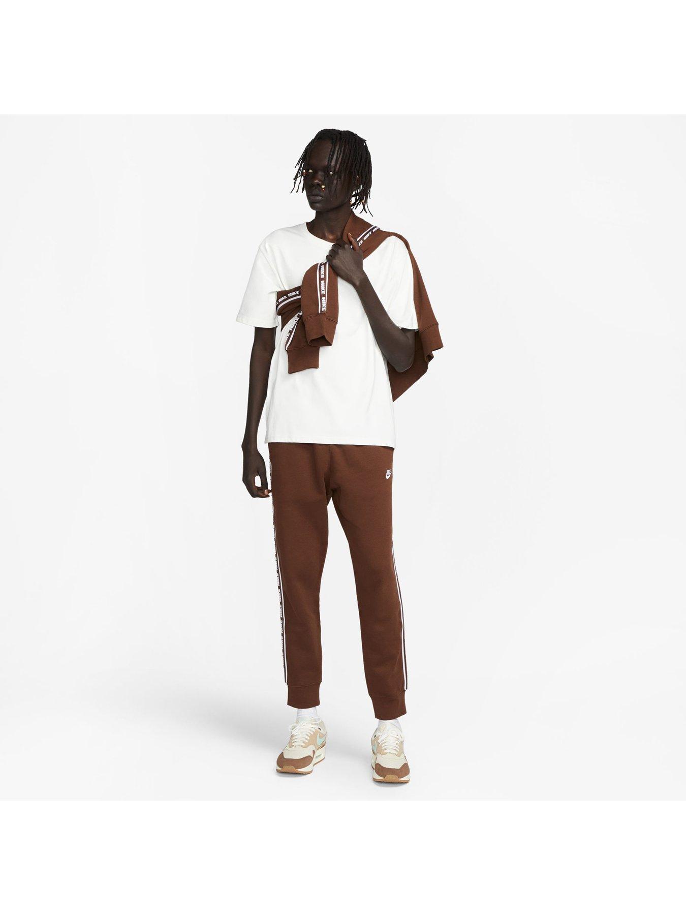 brown and white nike tracksuit