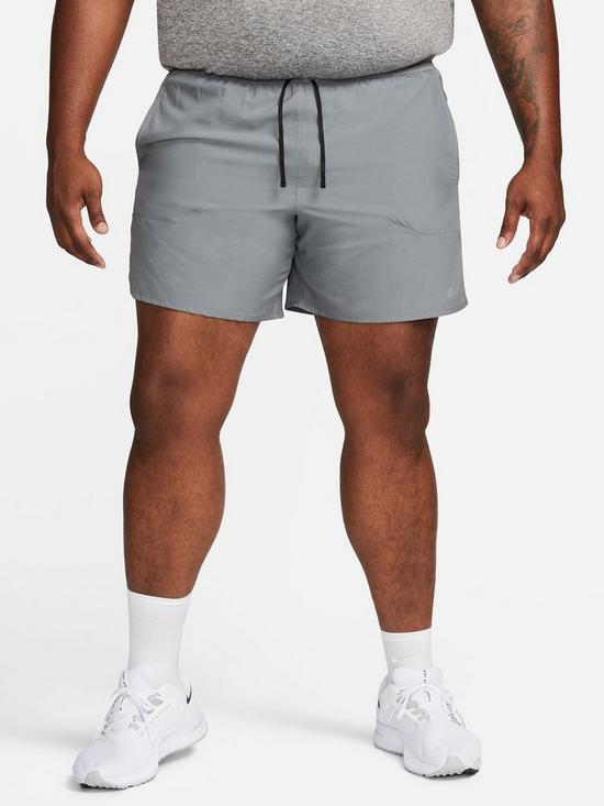front image of nike-dri-fit-stride-7-inch-running-shorts-grey