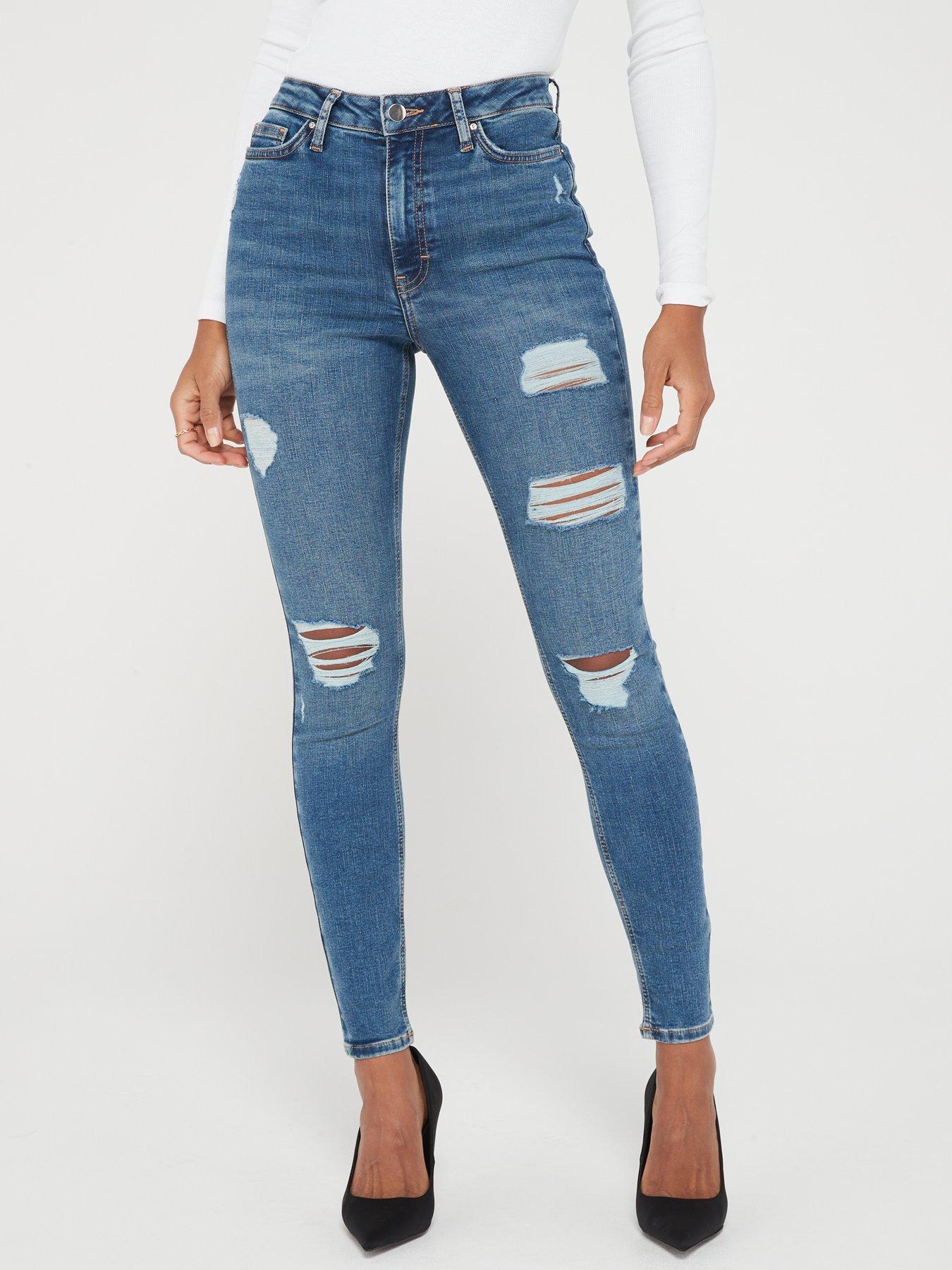 Ripped mid best sale rise jeans