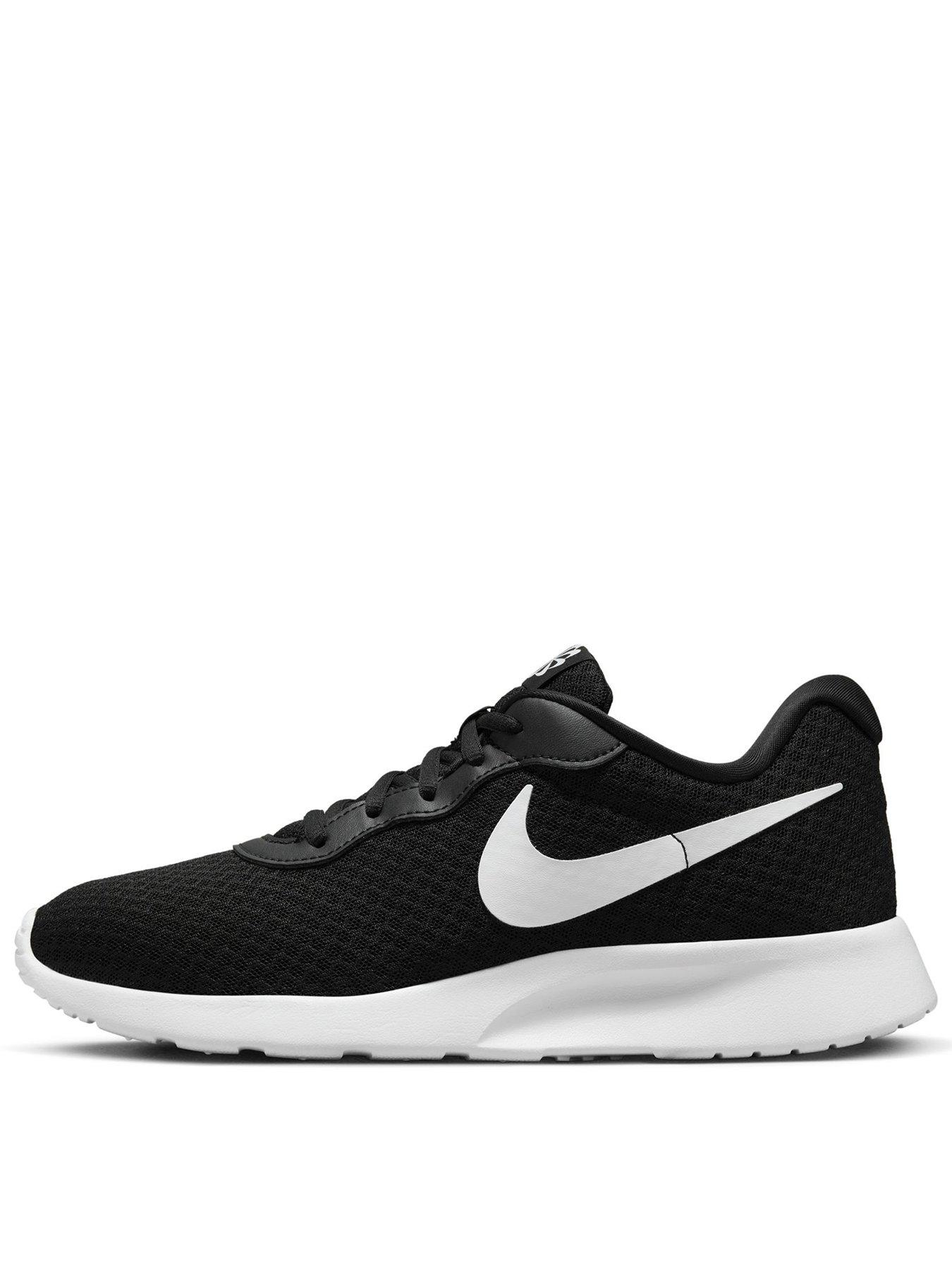 Nike tanjun best sale black and gold