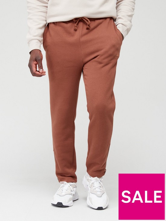 front image of adidas-sportswear-all-szn-pants-brown