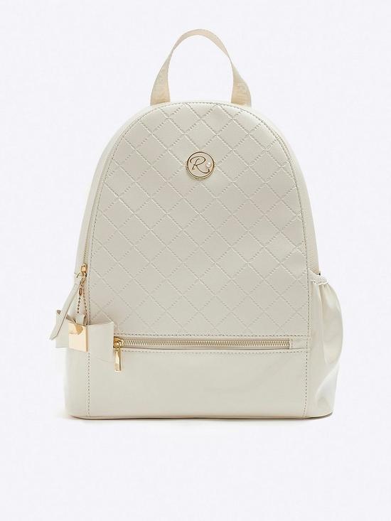 front image of river-island-girls-quilted-bow-detail-backpack-cream