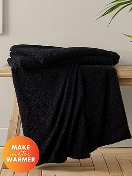 Product photograph of Catherine Lansfield Boucle Throw - Black from very.co.uk