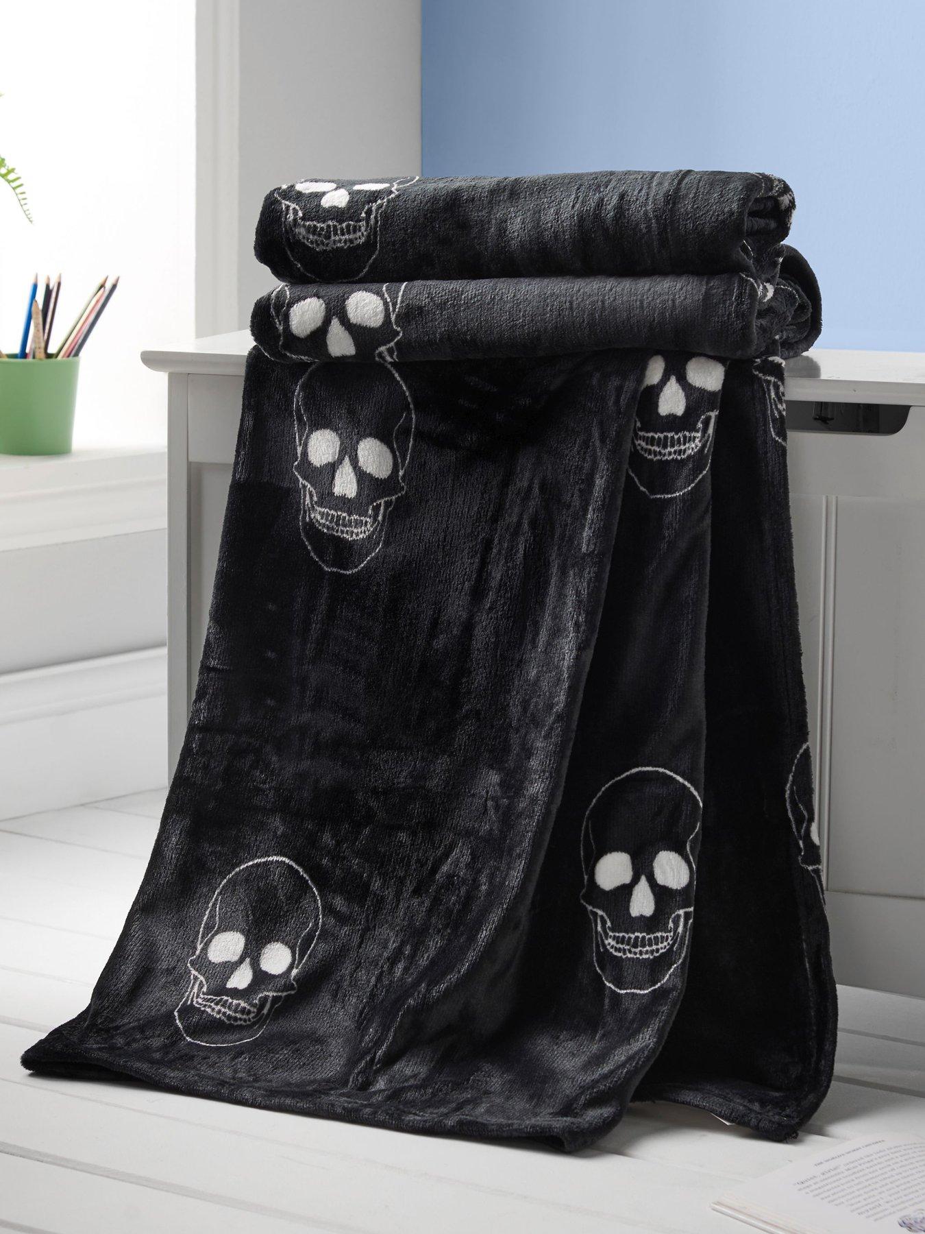 Product photograph of Catherine Lansfield Skulls Throw from very.co.uk