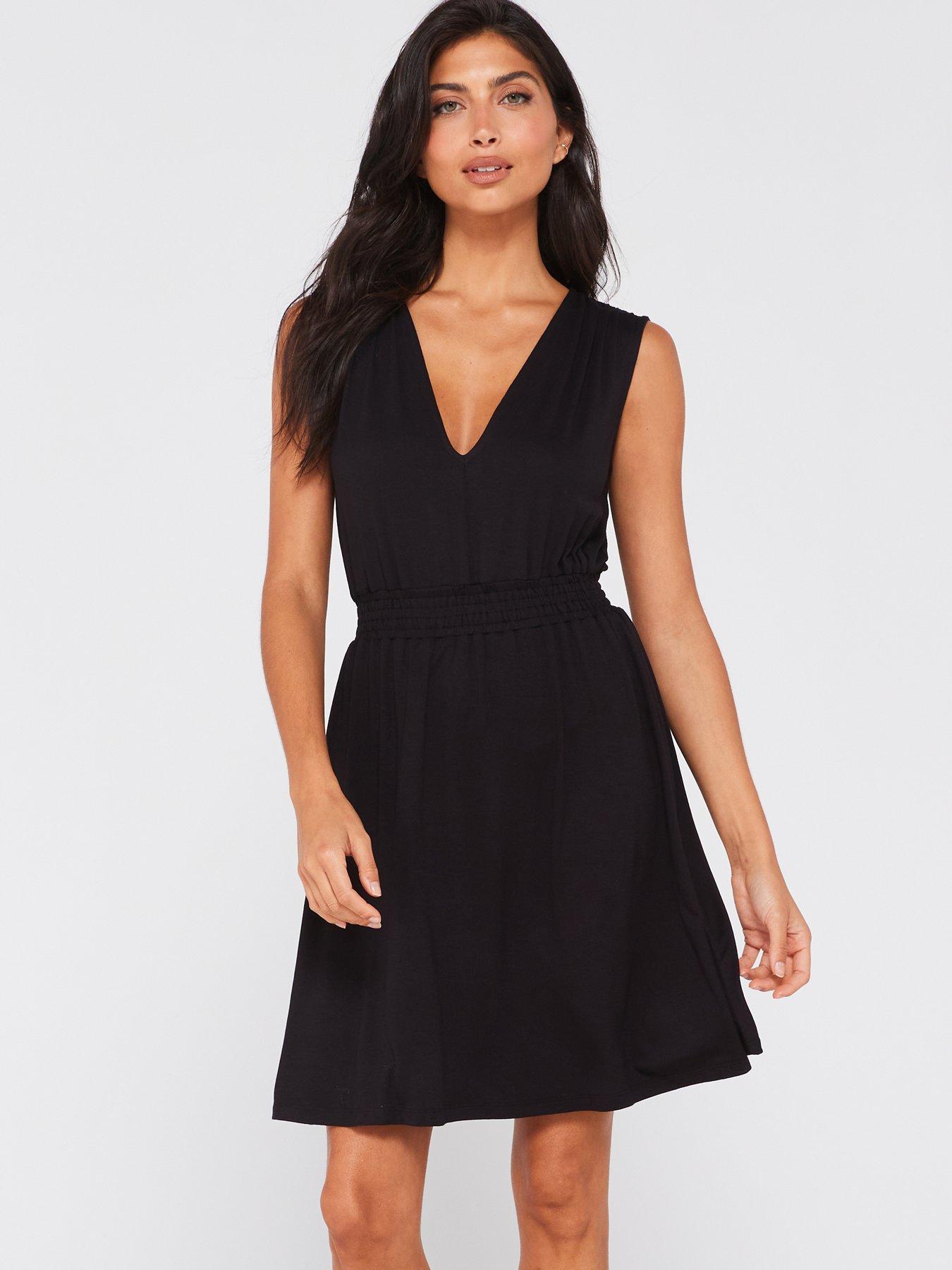 Jumper-style dress with bib-style front detail repeated at waist