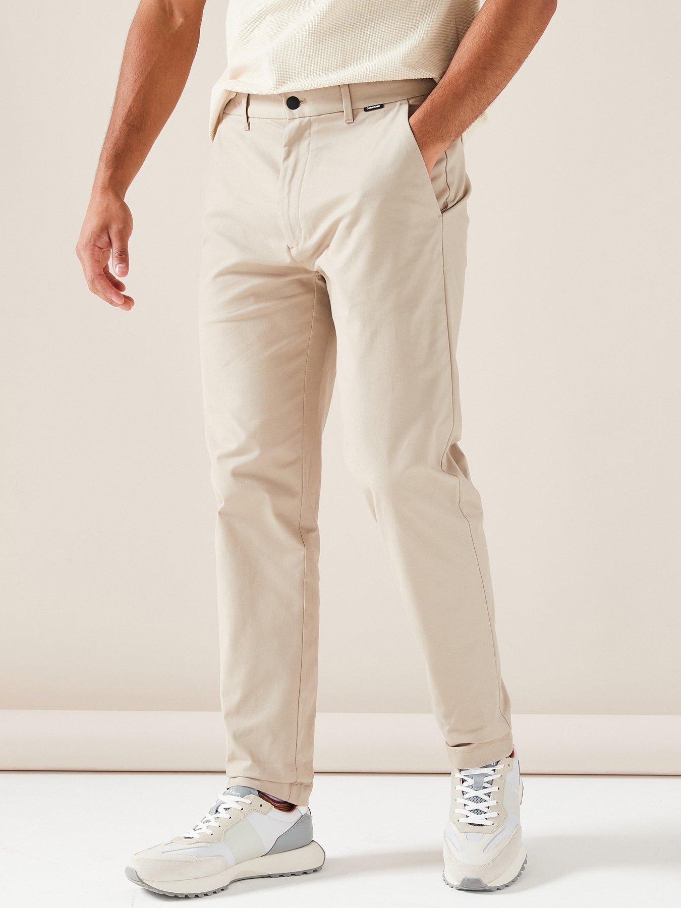 ARCADE X HIRO Y. WIDE-FIT TAPERED TROUSERS IN CREAM