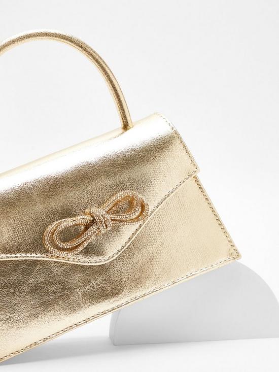stillFront image of quiz-gold-foil-diamante-bow-mini-tote-bag