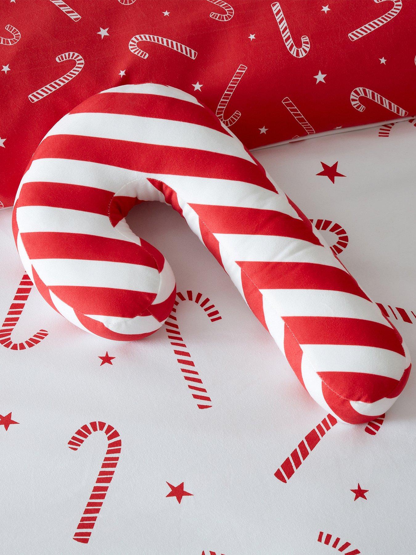 Product photograph of Catherine Lansfield Candy Cane Cushion from very.co.uk