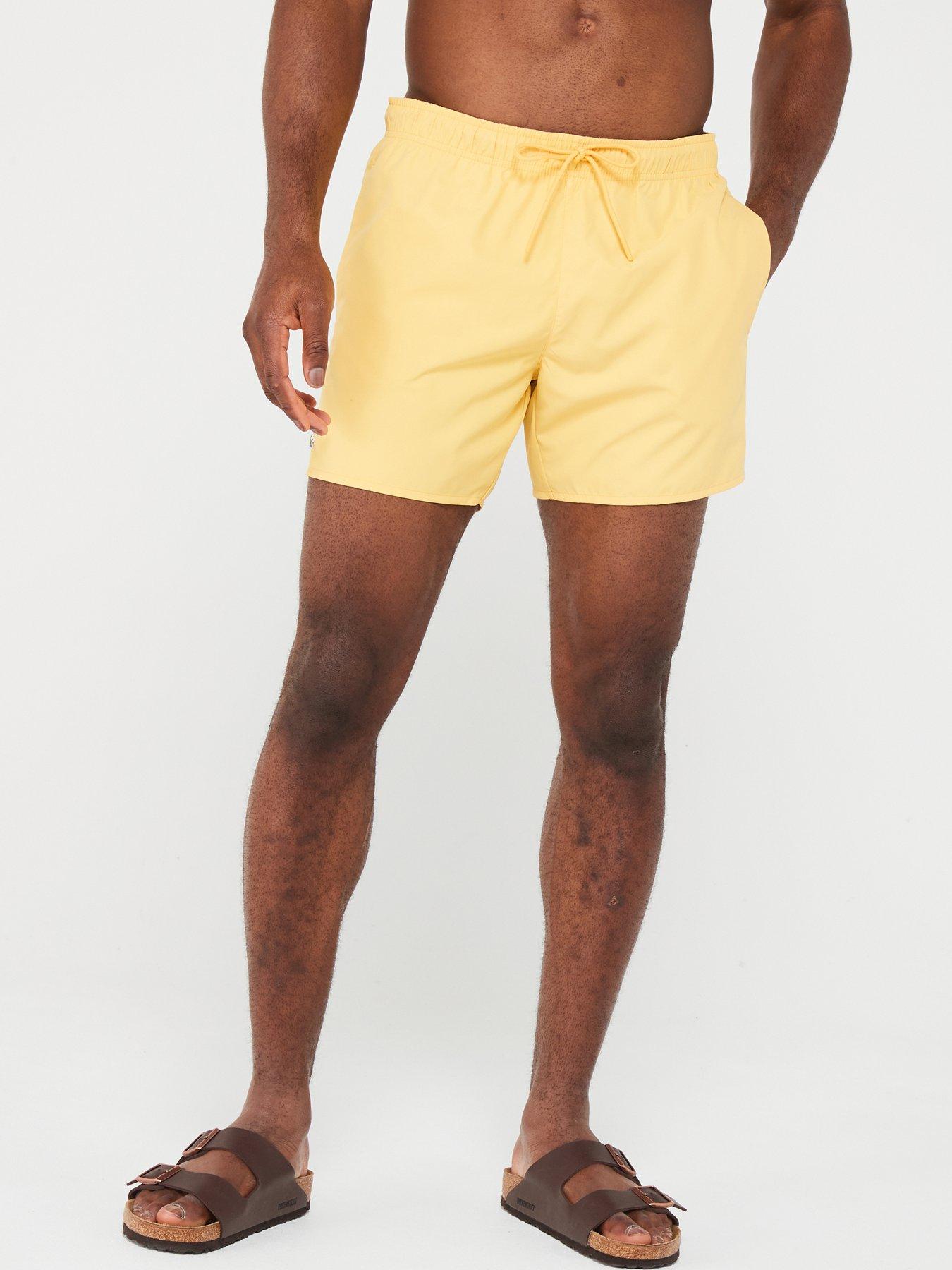 lacoste-essentials-swim-shorts-yellow