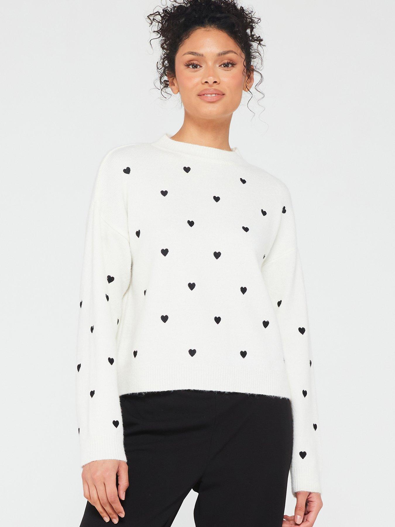 White sweater with black hearts top