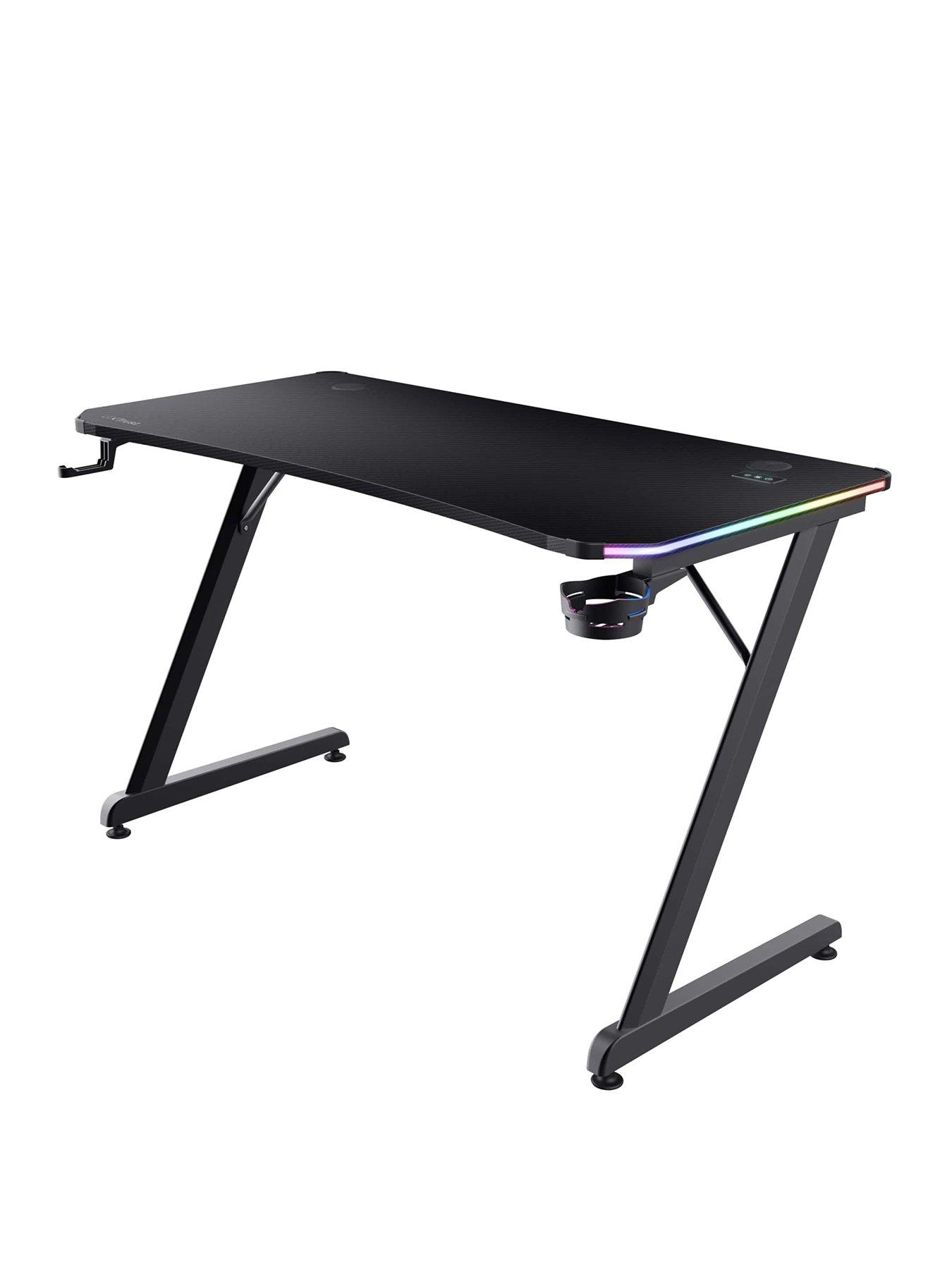 Product photograph of Trust Gxt709 Luminus Black Gaming Desk With Adjustable Rgb Led Lighting from very.co.uk