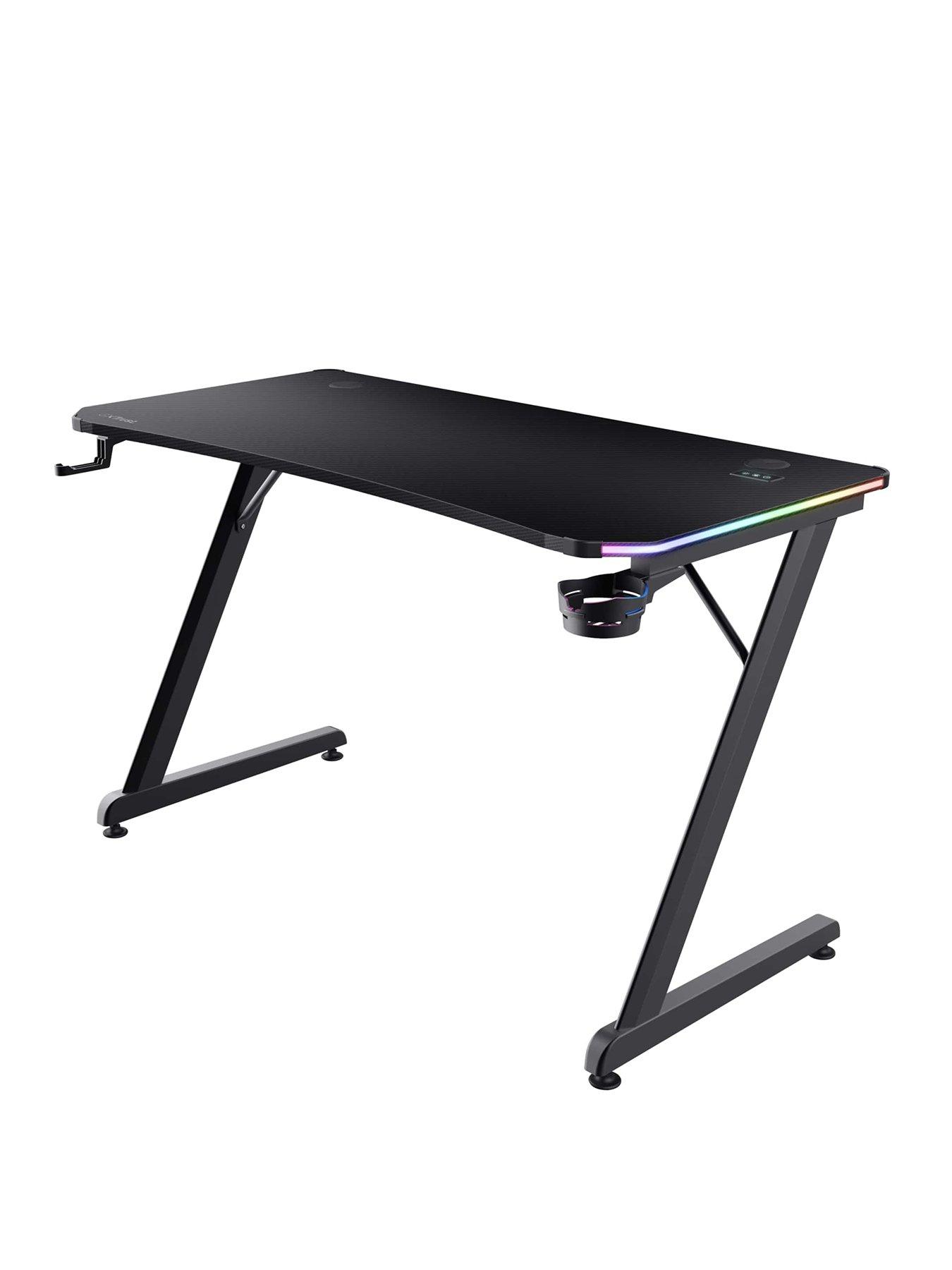 Product photograph of Trust Gxt709 Luminus Black Gaming Desk With Adjustable Rgb Led Lighting from very.co.uk