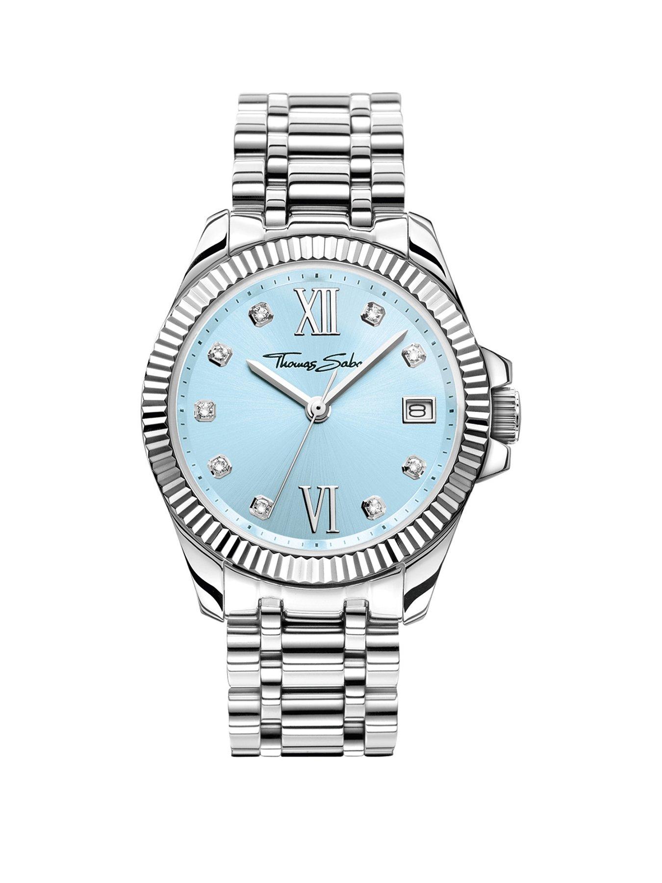 Thomas Sabo Women's Watch: Elegant light blue dial, white zirconia indexes, Roman numerals, fluted bezel, TS logo crown. Adjustable
