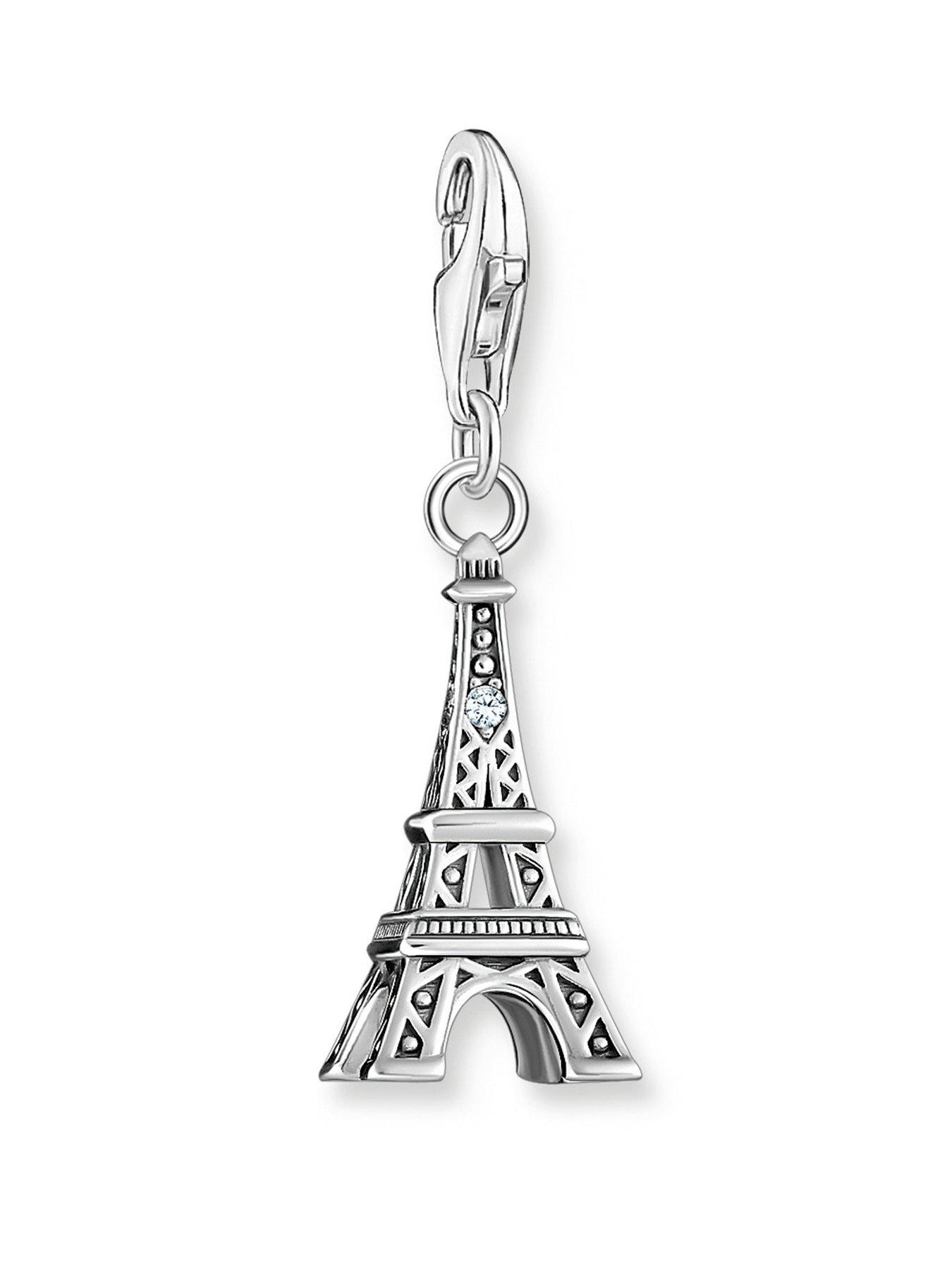 Thomas Sabo Eiffel Tower Charm: 3D iconic design, rich detail, cut-outs, engraved lines, white zirconia beacon. Mix with Charm Club pieces