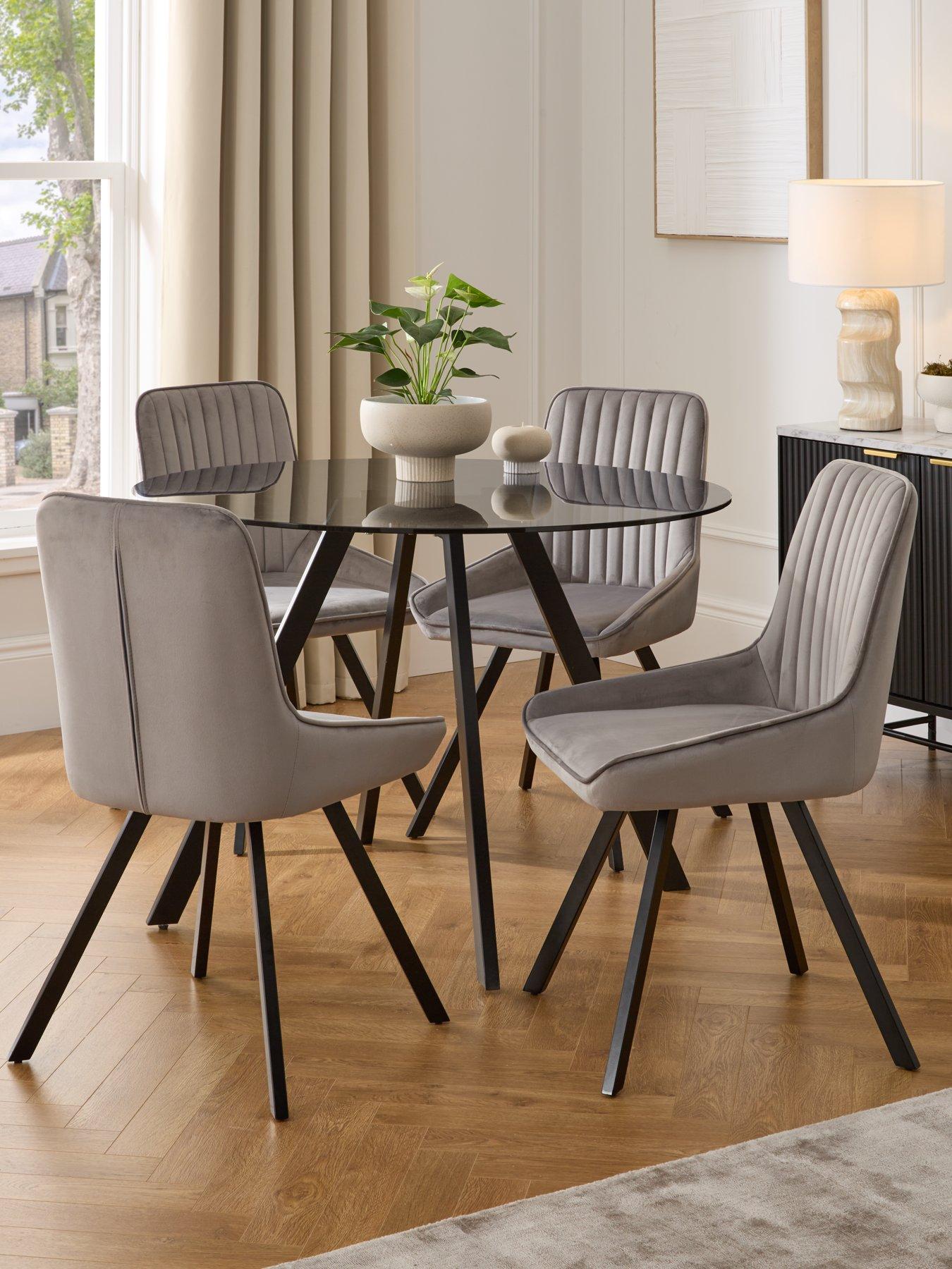 Product photograph of Very Home Marlow 110 Cm Round Smoked Glass Top Dining Table 4 Fabric Chairs - Grey Black from very.co.uk