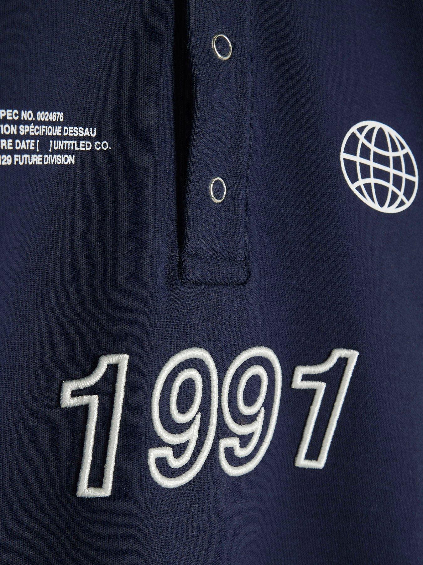 Image 4 of 4 of River Island Older Boy Tipped 1991 Graphic Polo Shirt - Navy