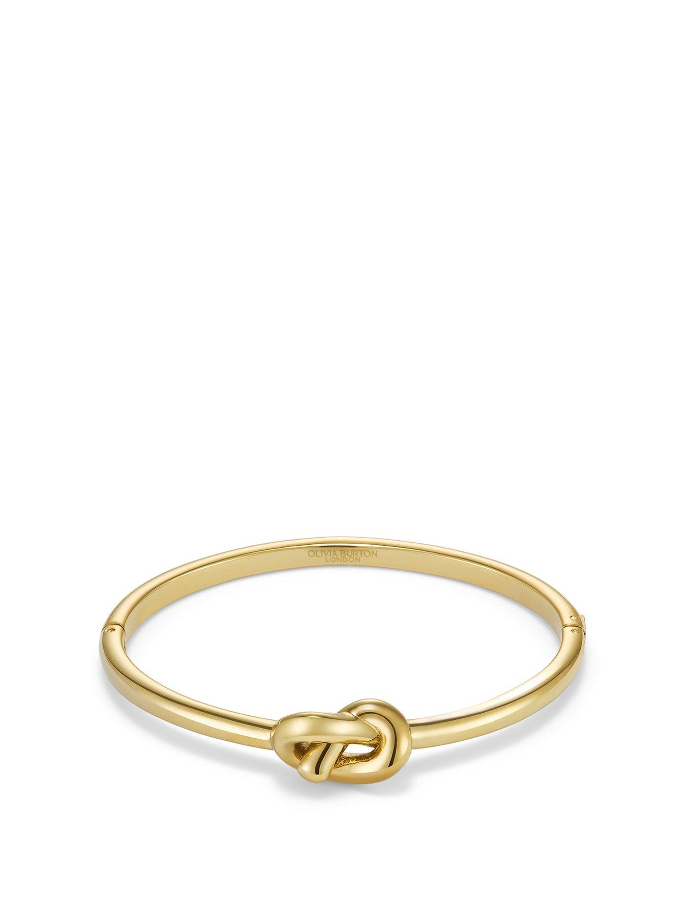 Product photograph of Olivia Burton Lovers Knot Gold Ip Hinged Bangle from very.co.uk