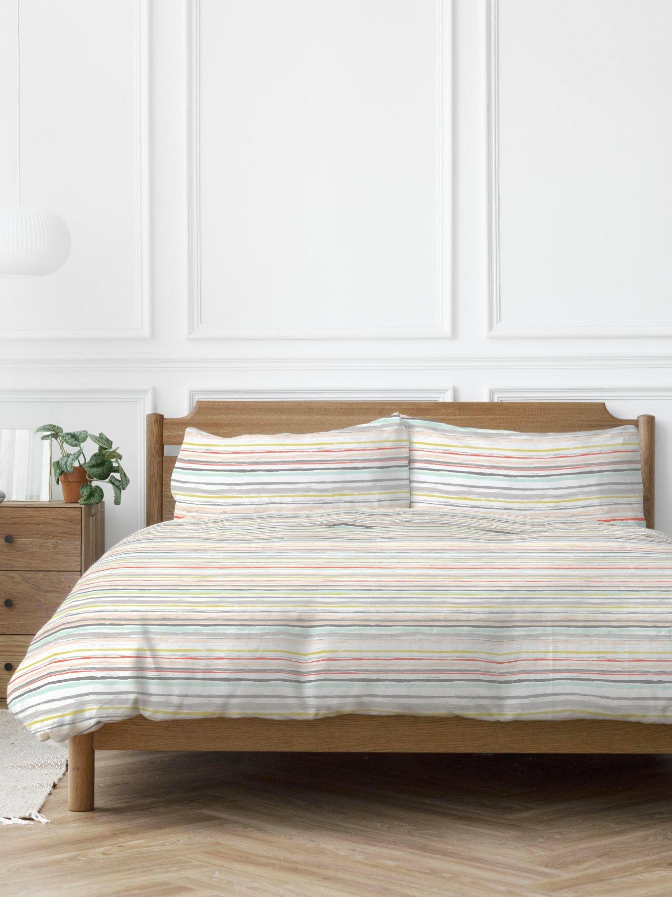 Product photograph of Copenhagen Home Painterly Stripe Coral Peach 100 Cotton Duvet Set from very.co.uk
