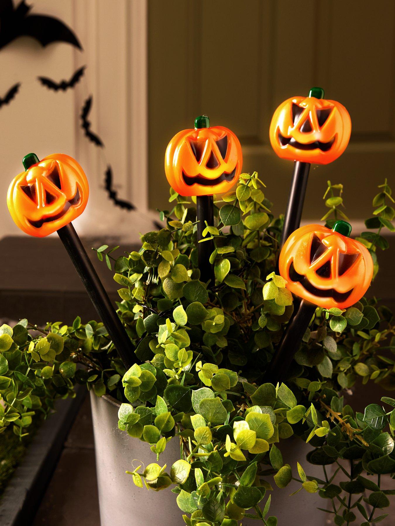 Product photograph of Heaven Sends Set Of 4 Solar Powered Pumpkin Stake Outdoor Halloween Lights from very.co.uk