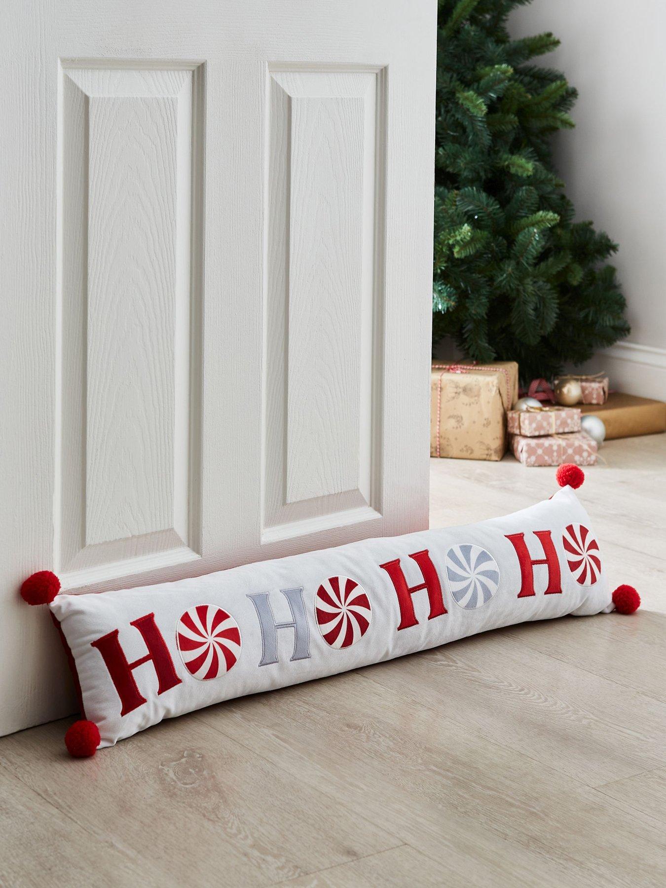 Product photograph of Catherine Lansfield Ho Ho Ho Draught Excluder - White Red from very.co.uk