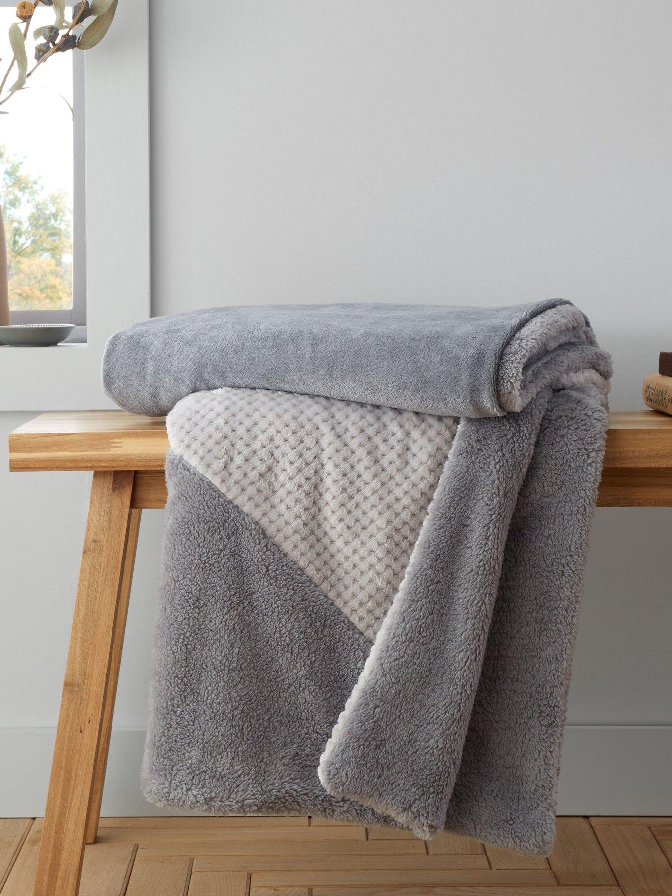 Product photograph of Catherine Lansfield Larsson Geo Cosy Fleece Throw - Grey from very.co.uk