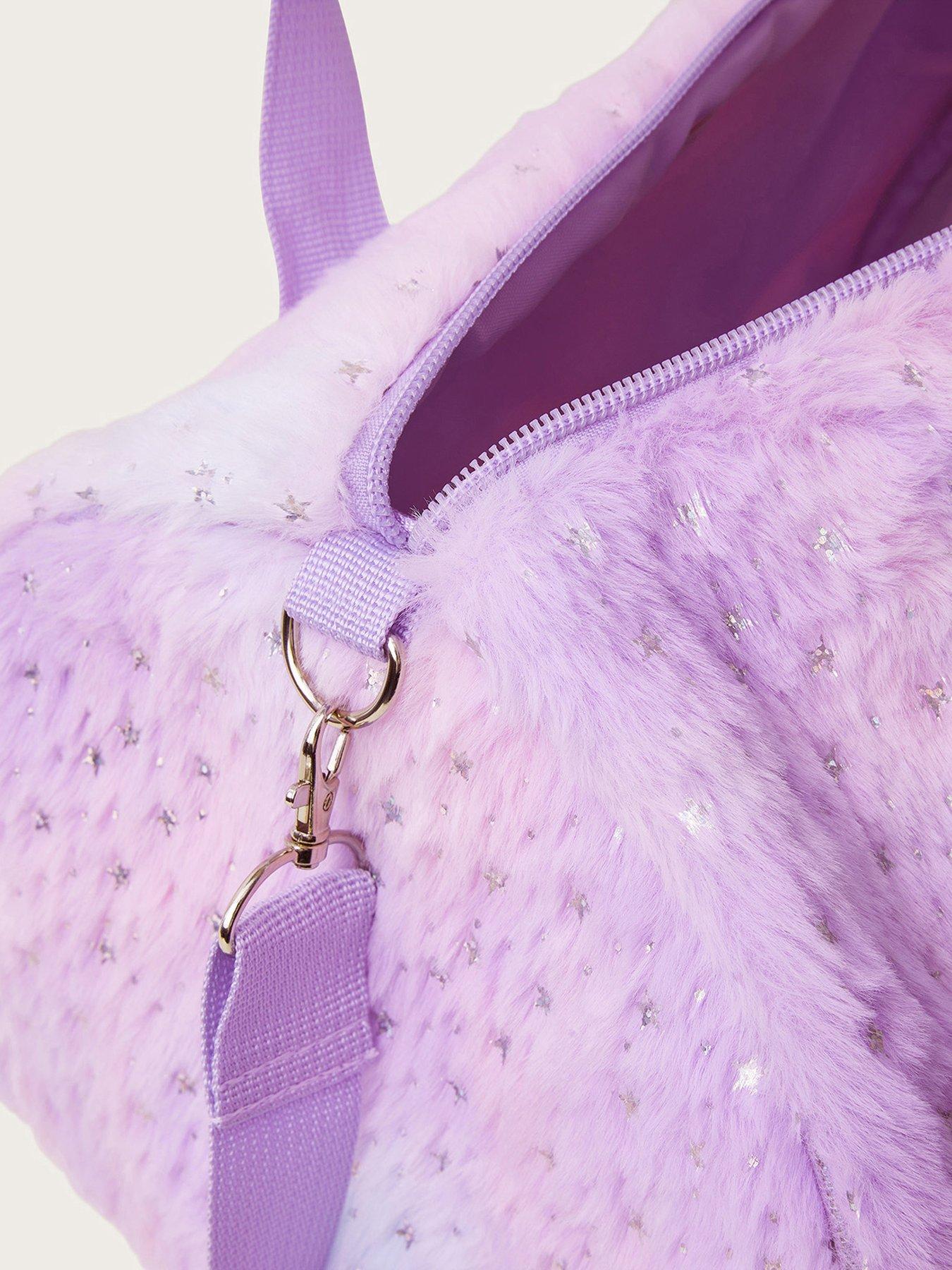 Pink fuzzy duffle bag on sale