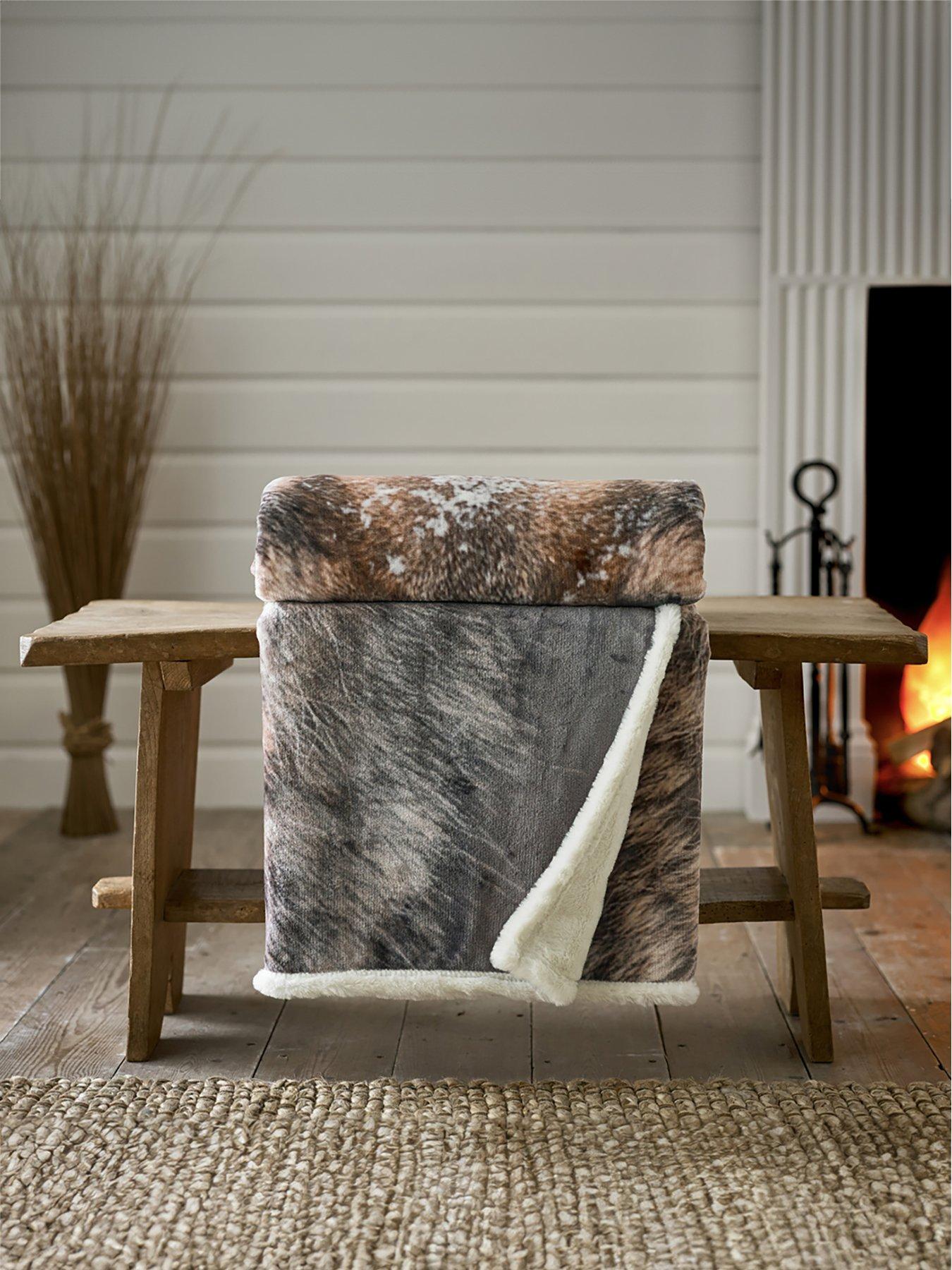 Wolf faux fur throw by catherine lansfield sale